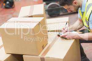 Warehouse worker with clipboard