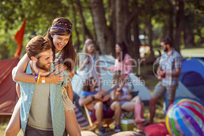 Hipster couple having fun on campsite