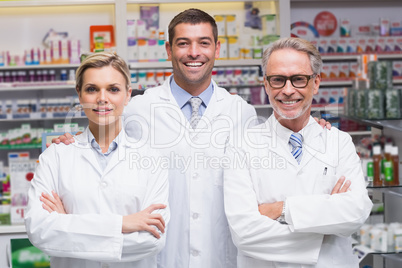 Team of pharmacists smiling at camera