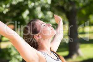 Fit brunette on a run in the park