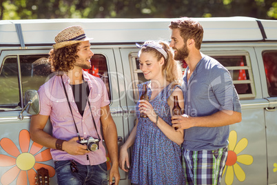 Hipster friends chatting and drinking