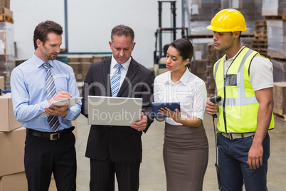 Focused warehouse team working together