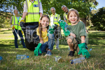 Happy family collecting rubbish