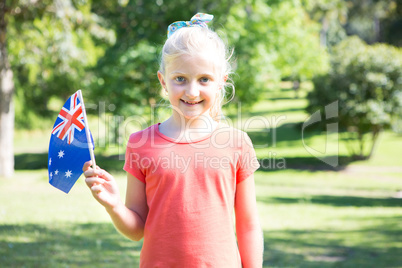 Little girl waving australian flag