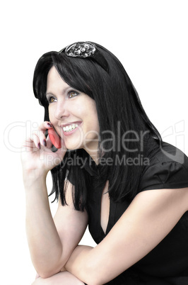 Smiling woman with a phone on a white background