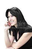 Smiling woman with a phone on a white background