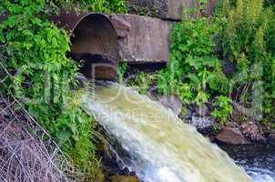 Discharge of water from the pipe in the river