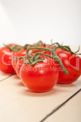 fresh cherry tomatoes on a cluster