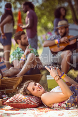 Pretty hipster relaxing on campsite