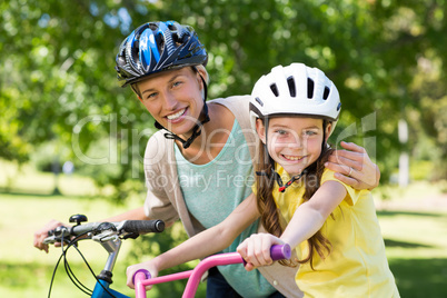 Mother and daughter on their bike