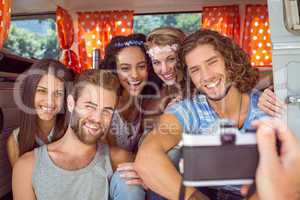 Hipster friends in a camper van