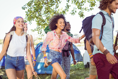 Young friends arriving at their campsite