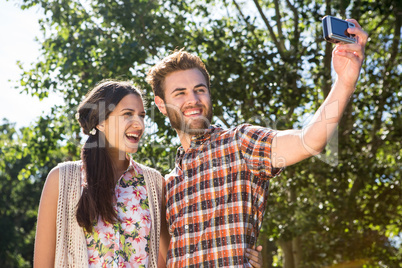 Hipster couple taking a selfie Hipster couple taking a selfie