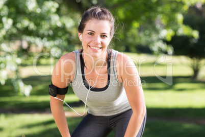 Fit brunette on a run in the park