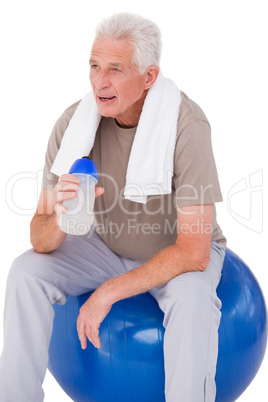 Senior man taking a break from exercise