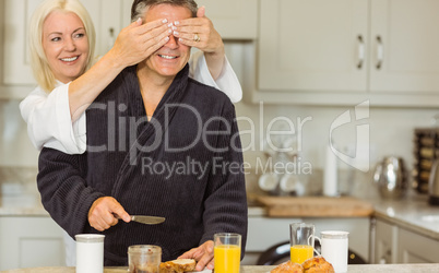 Mature couple having breakfast together