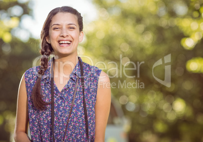 Pretty hipster smiling at camera