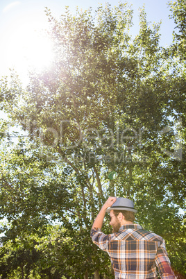 Handsome hipster walking in the park