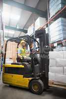 Focused driver operating forklift machine