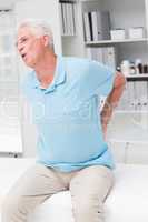 Senior man screaming due to back pain