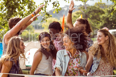 Happy hipsters dancing to the music