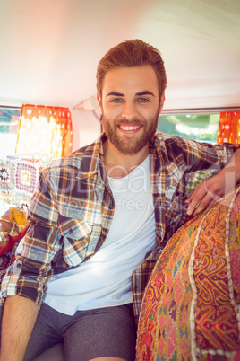 Hipster on road trip in camper van