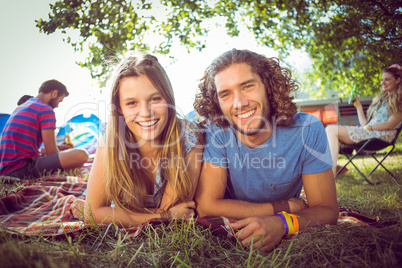 Hipster couple smiling at camera