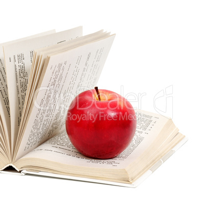 red apple on a book