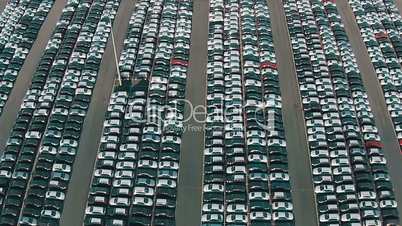 Flying Above Storage Parking Lot of New Unsold Cars, aerial view