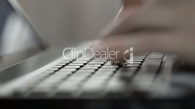 Womans Hands Typing On A Laptop Keyboard