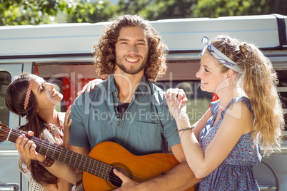 Hipster playing guitar for girls