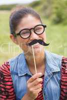 Pretty brunette with fake mustache