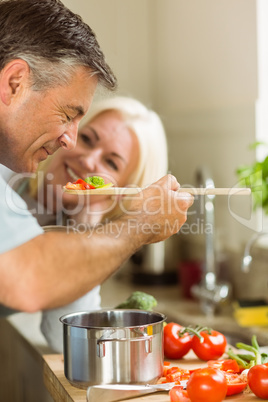 Mature couple preparing vegetarian meal together