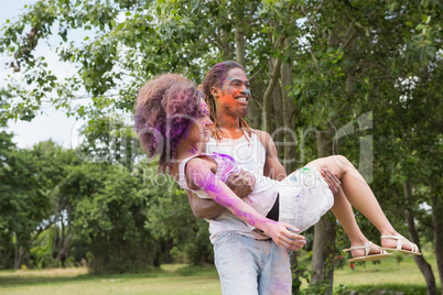 Young friends having fun with powder paint