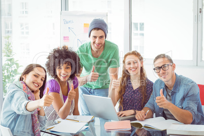 Fashion students smiling at camera together