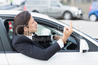 Businessman experiencing road rage