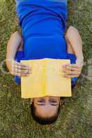 Pretty woman reading in the park