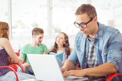 Fashion student using laptop