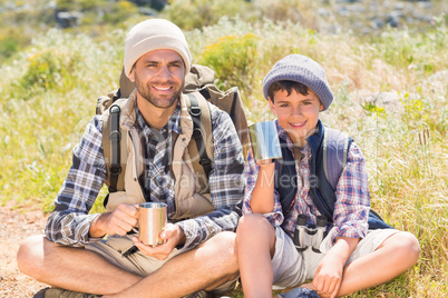 Father and son hiking in the mountains