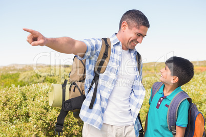 Father and son hiking in the mountains