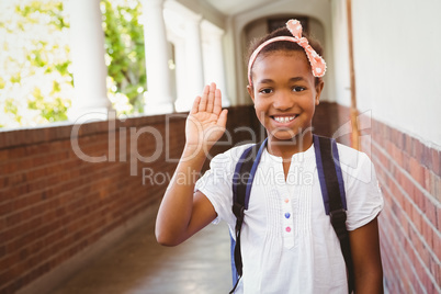 Little girl smiling in school corridor