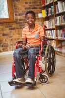 Boy sitting in wheelchair at library