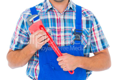 Cropped image of repairman holding monkey wrench
