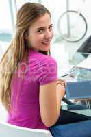 Casual young woman with digital tablet
