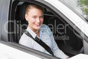 Happy businesswoman in the drivers seat