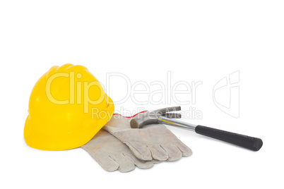 Gloves with hammer and hardhat on white background