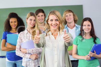 College students gesturing thumbs up