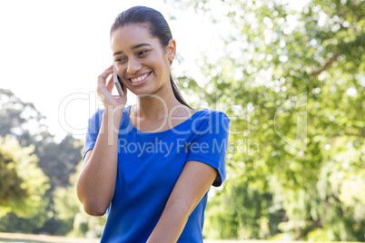 Woman using phone in park
