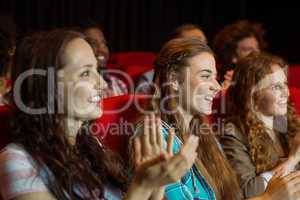 Young friends watching a film