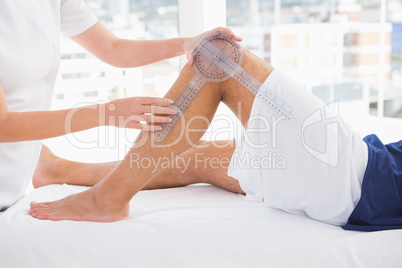 Doctor examining man leg